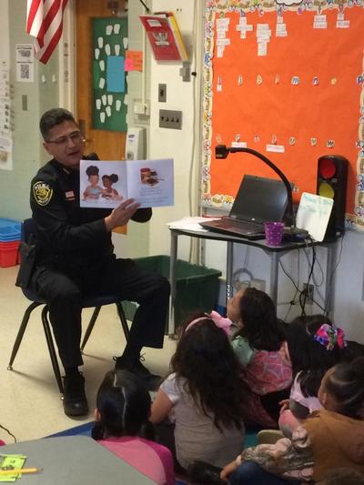 Chief Amado Reading to Mission View Students