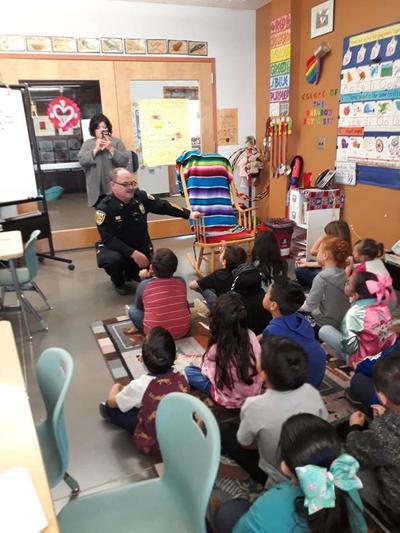 Commander Shonk Reading to Students
