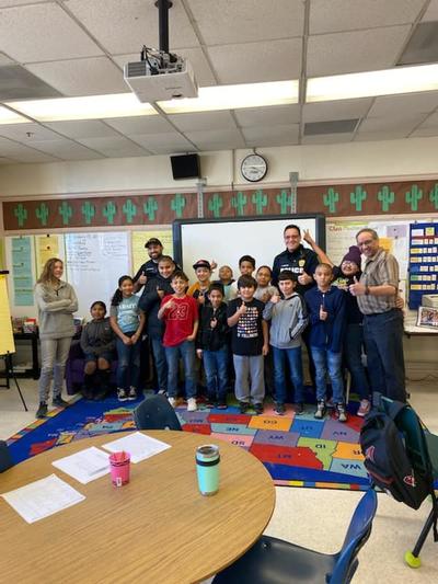 Officer Chavez and Officer Elliott Reading to Students